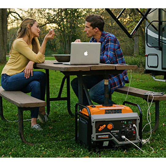 Couple with RV using portable generator to charge electronics